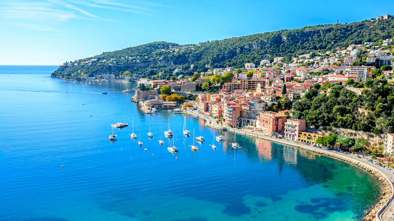 Turquoise bay with a coastal town on the Côte d'Azur
